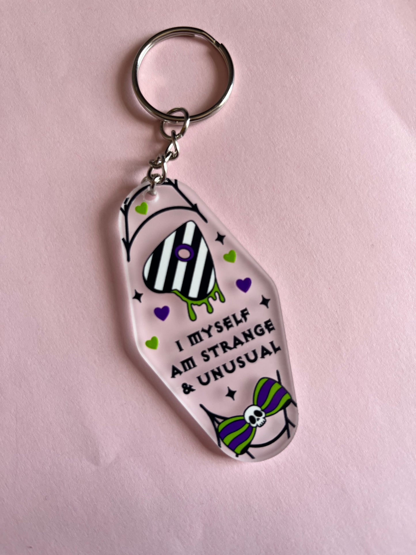 Strange & Unusual Clear Keyring
